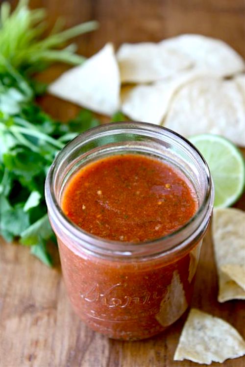 Restaurant Style Salsa Recipe on twopeasandtheirpod.com This easy blender salsa is SO good! Our family's very favorite! homemade salsa in jar