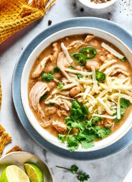 Overhead view of a bowl of white chicken chili garnished with fresh cilantro.