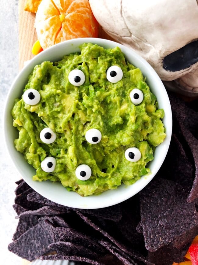 Spooky Guacamole on Halloween Snack Board