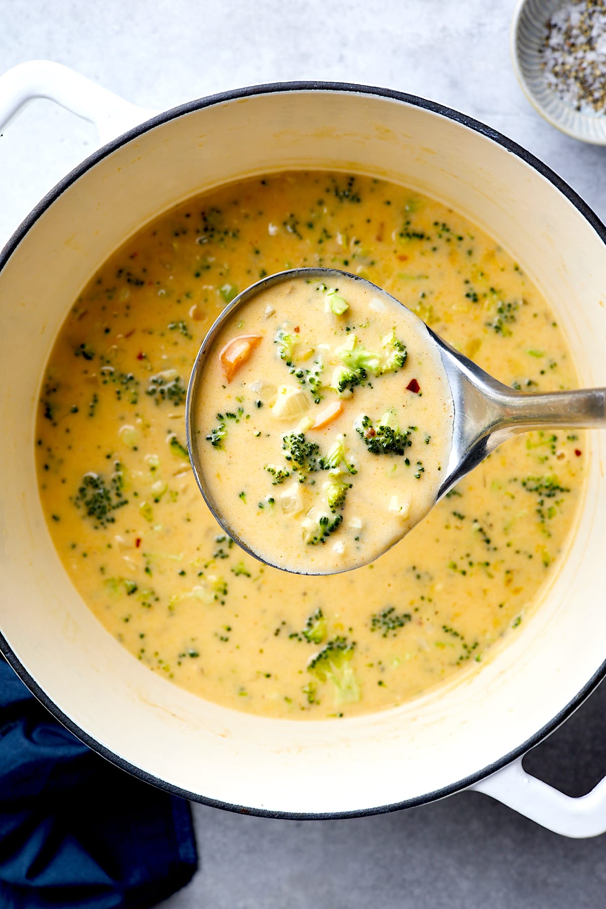 Broccoli Cheese Soup in ladle.