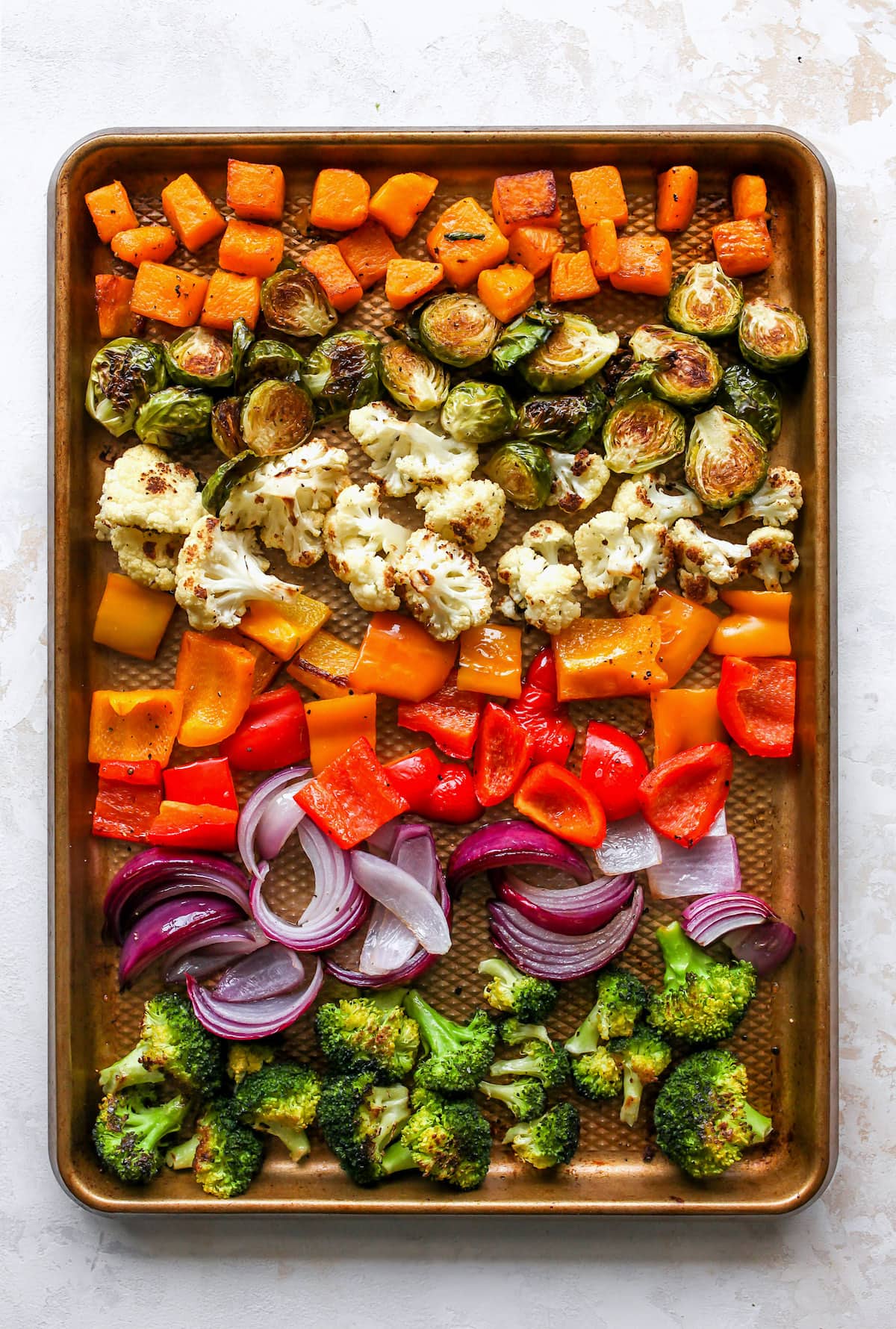 Roasted vegetables on sheet pan.