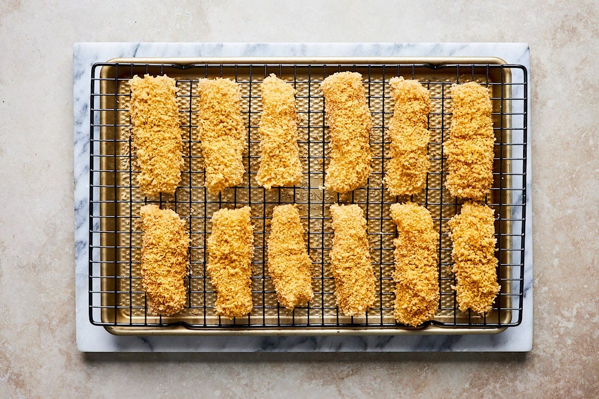 fish sticks on wire rack on baking sheet.