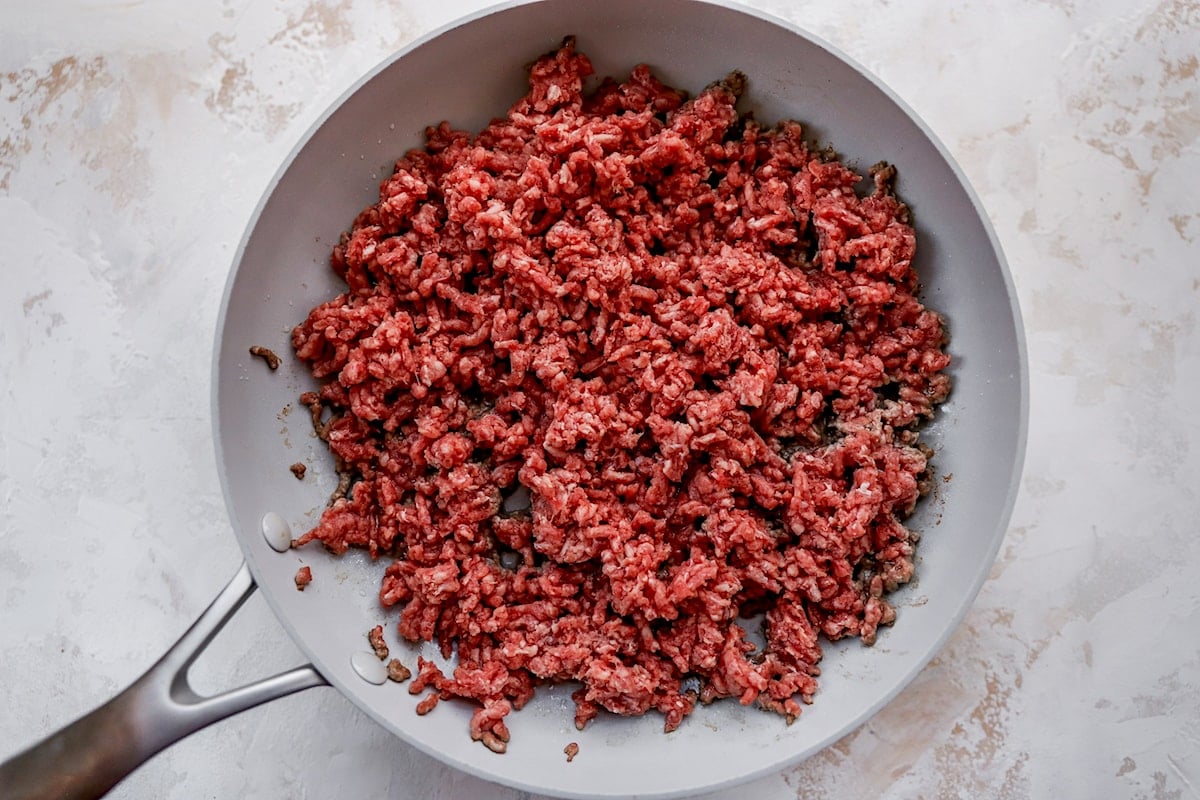 ground beef cooking in skillet for taco salad.