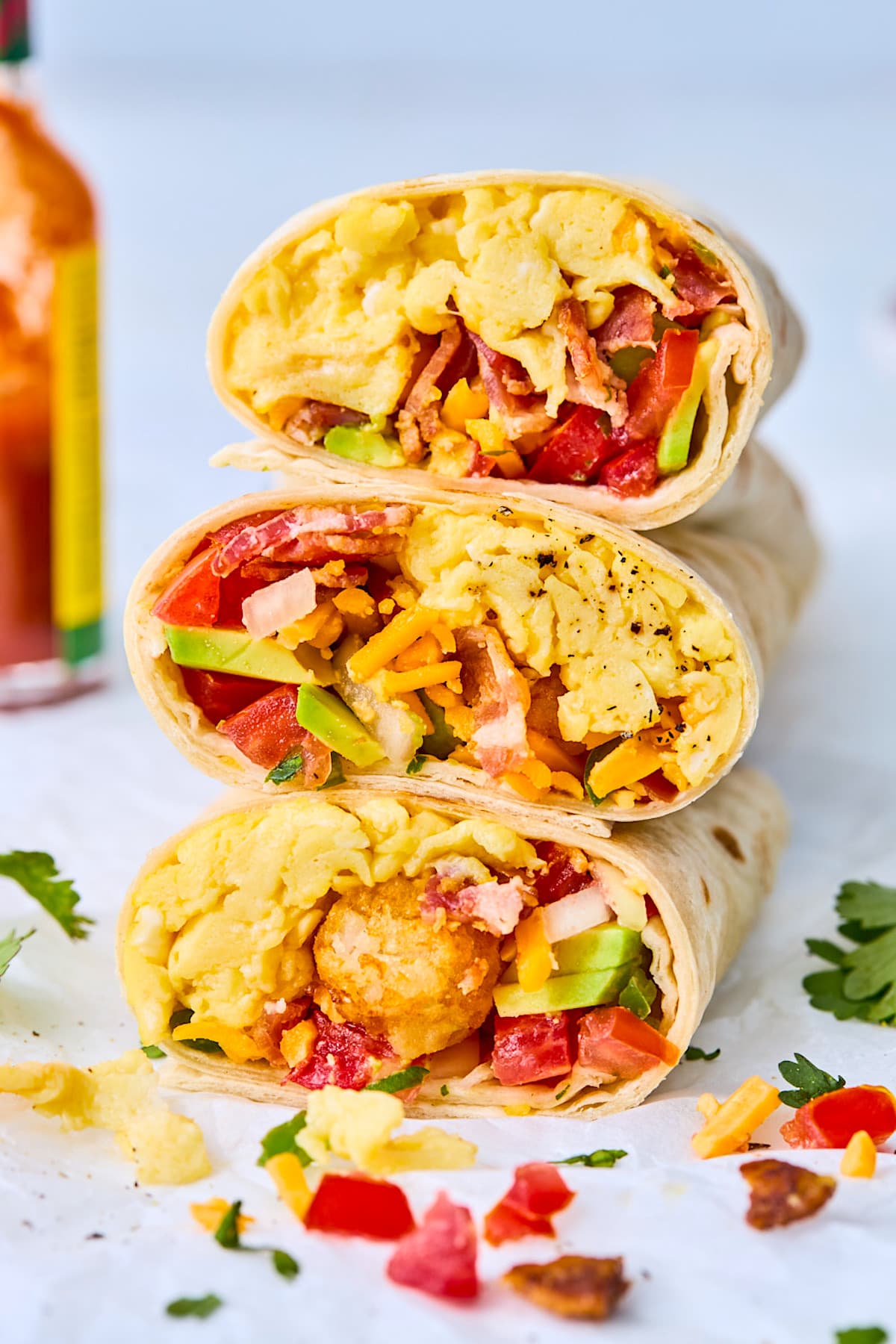 breakfast burritos cut in half and stacked.