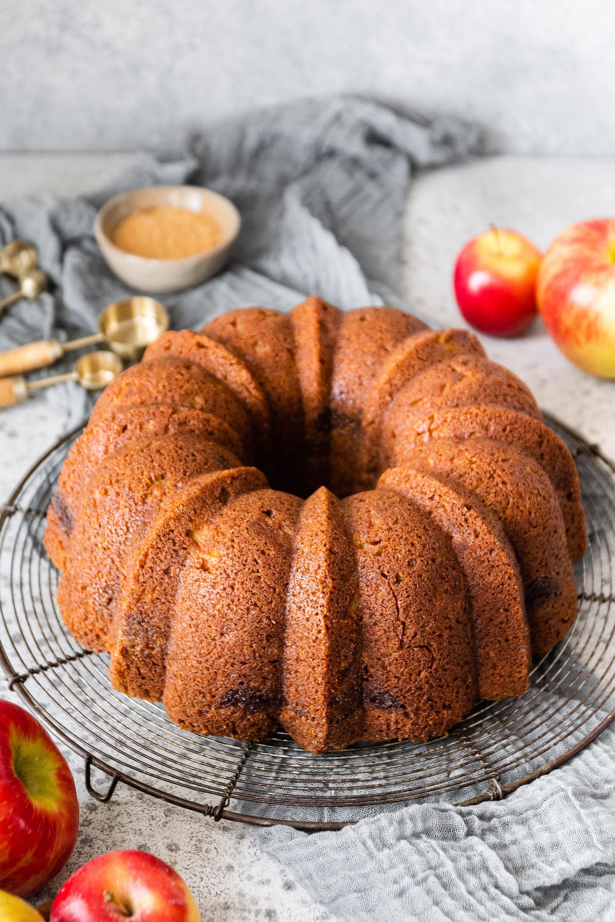 apple bundt cake on cooling rack. 