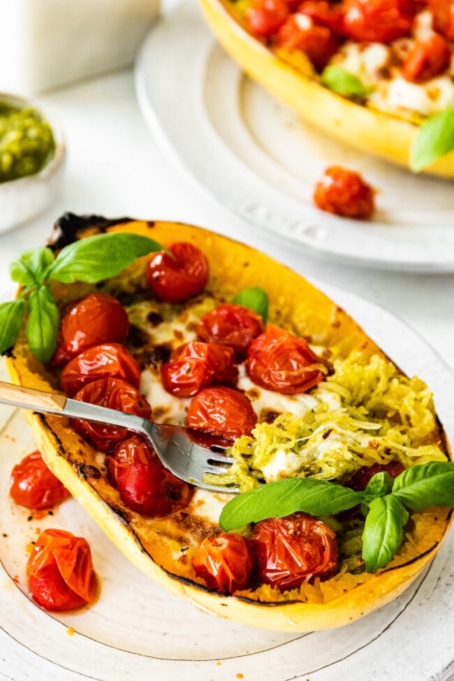 Baked Spaghetti Squash with Pesto, Mozzarella, and Roasted Tomatoes