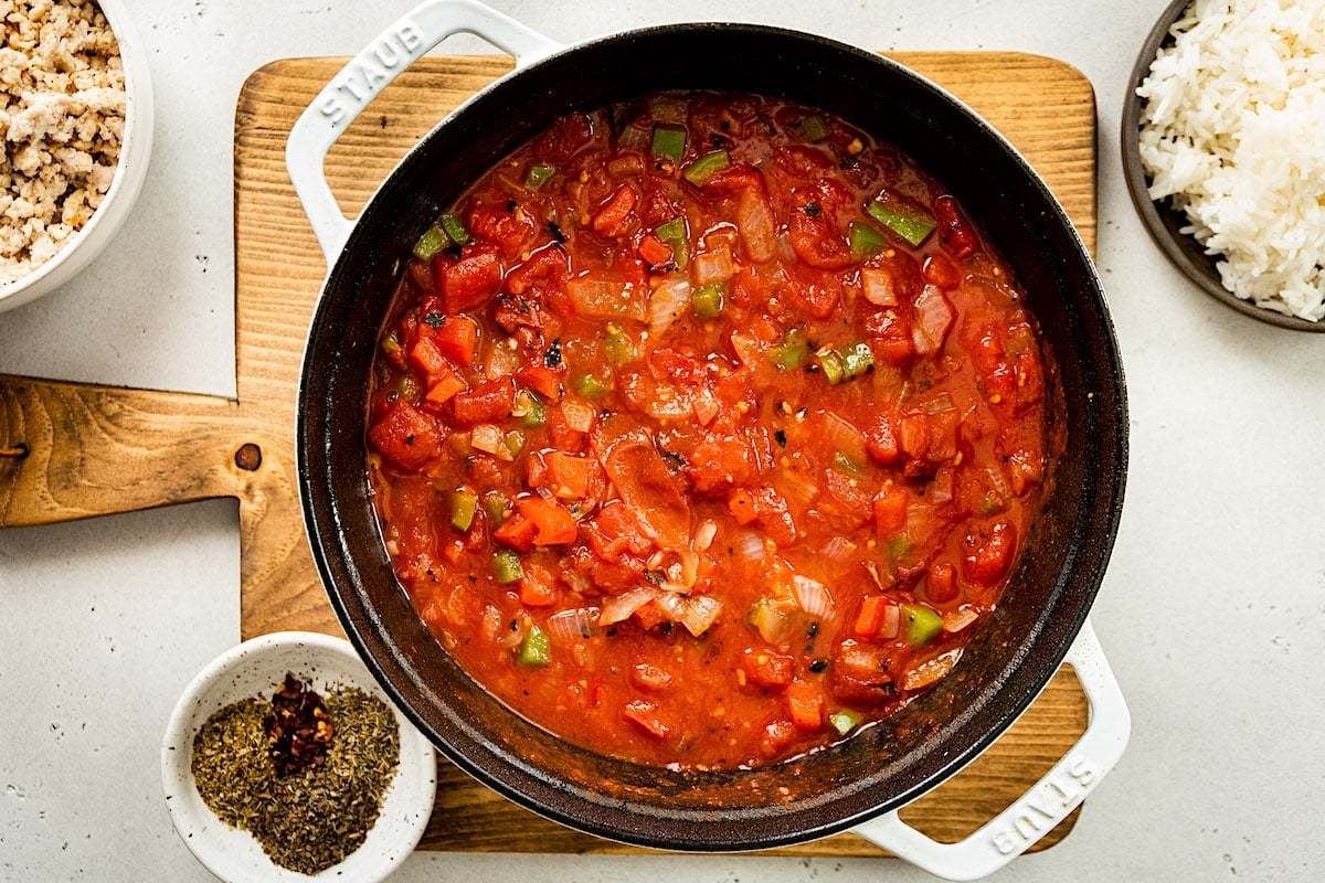 stuffed pepper soup ingredients in white pot.