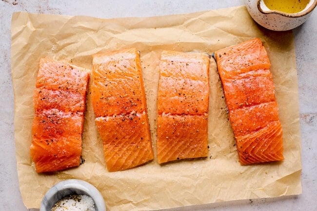 salmon steaks on parchment paper.