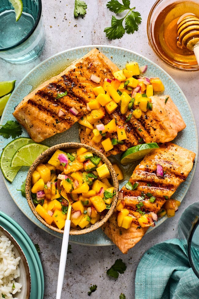 grilled salmon on plate with mango peach salsa.