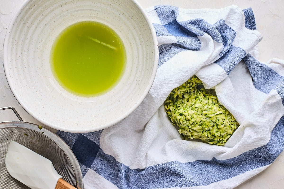shredded zucchini in towel to remove excess moisture.