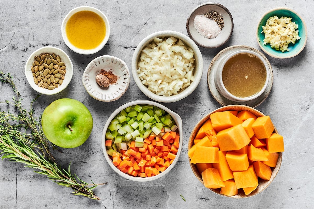 butternut squash soup ingredients in bowls.
