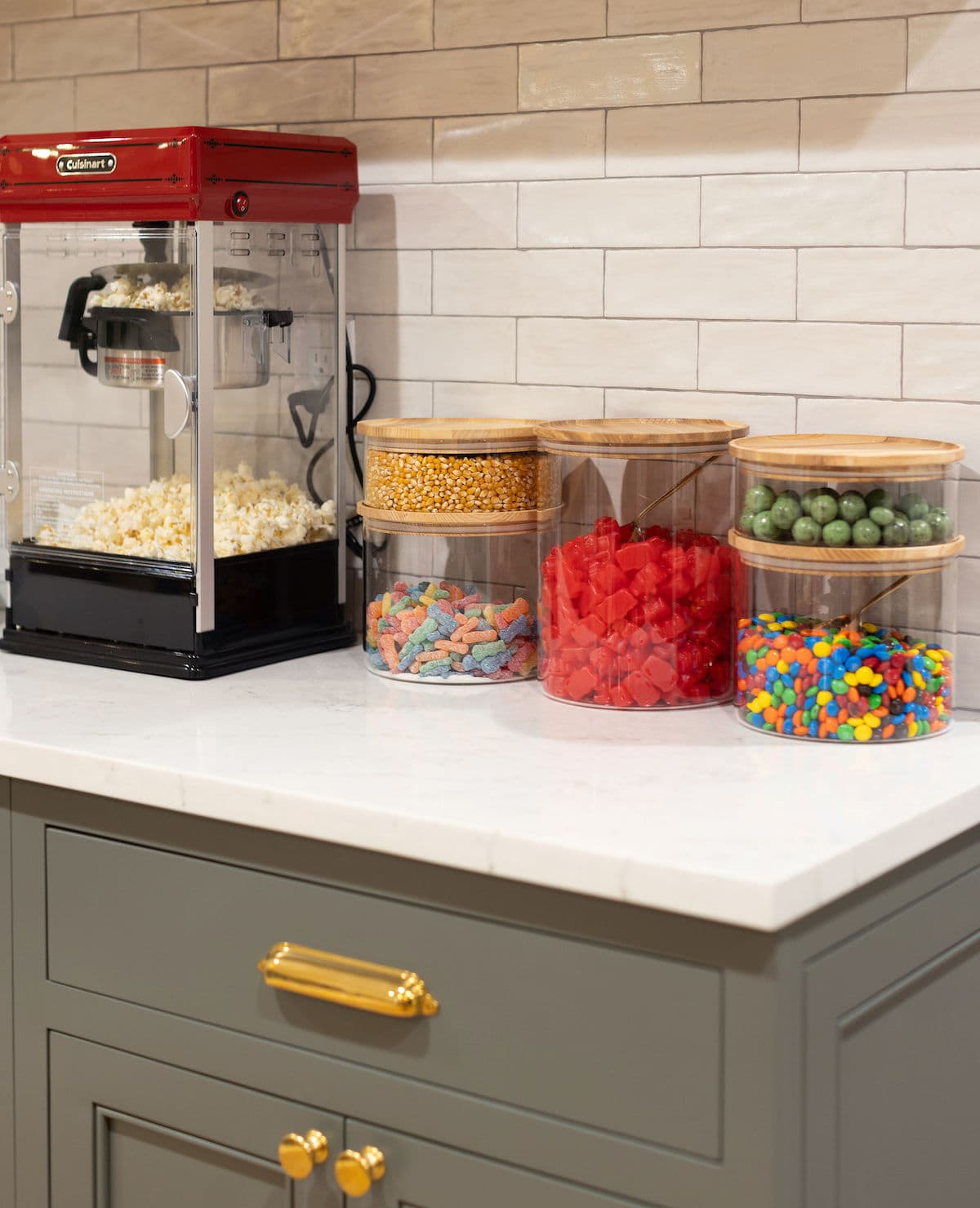basement theater snack area with popcorn make rand candy jars.