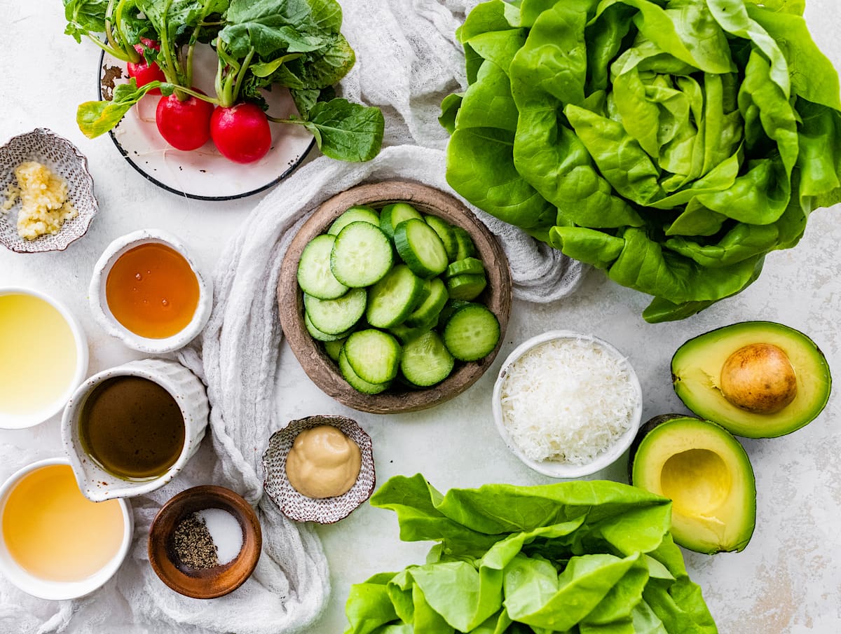 butter lettuce salad ingredients in bowls.