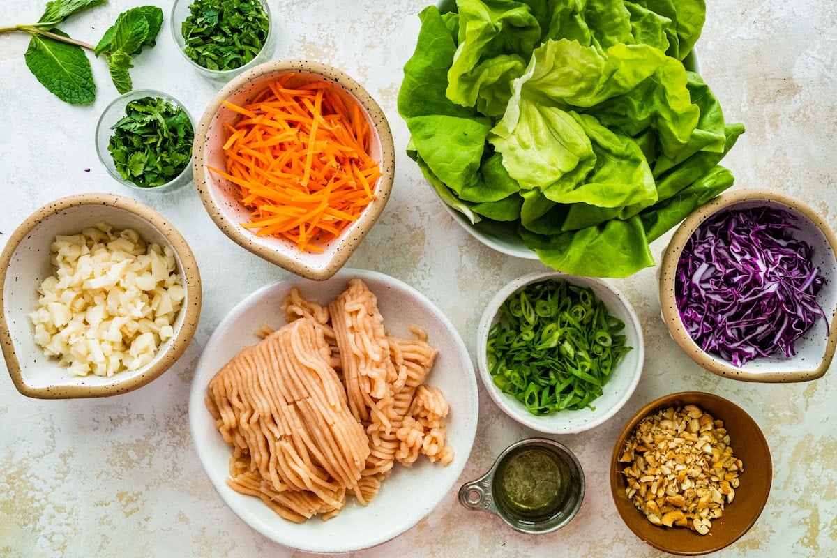 lettuce wrap ingredients prepped in bowls.
