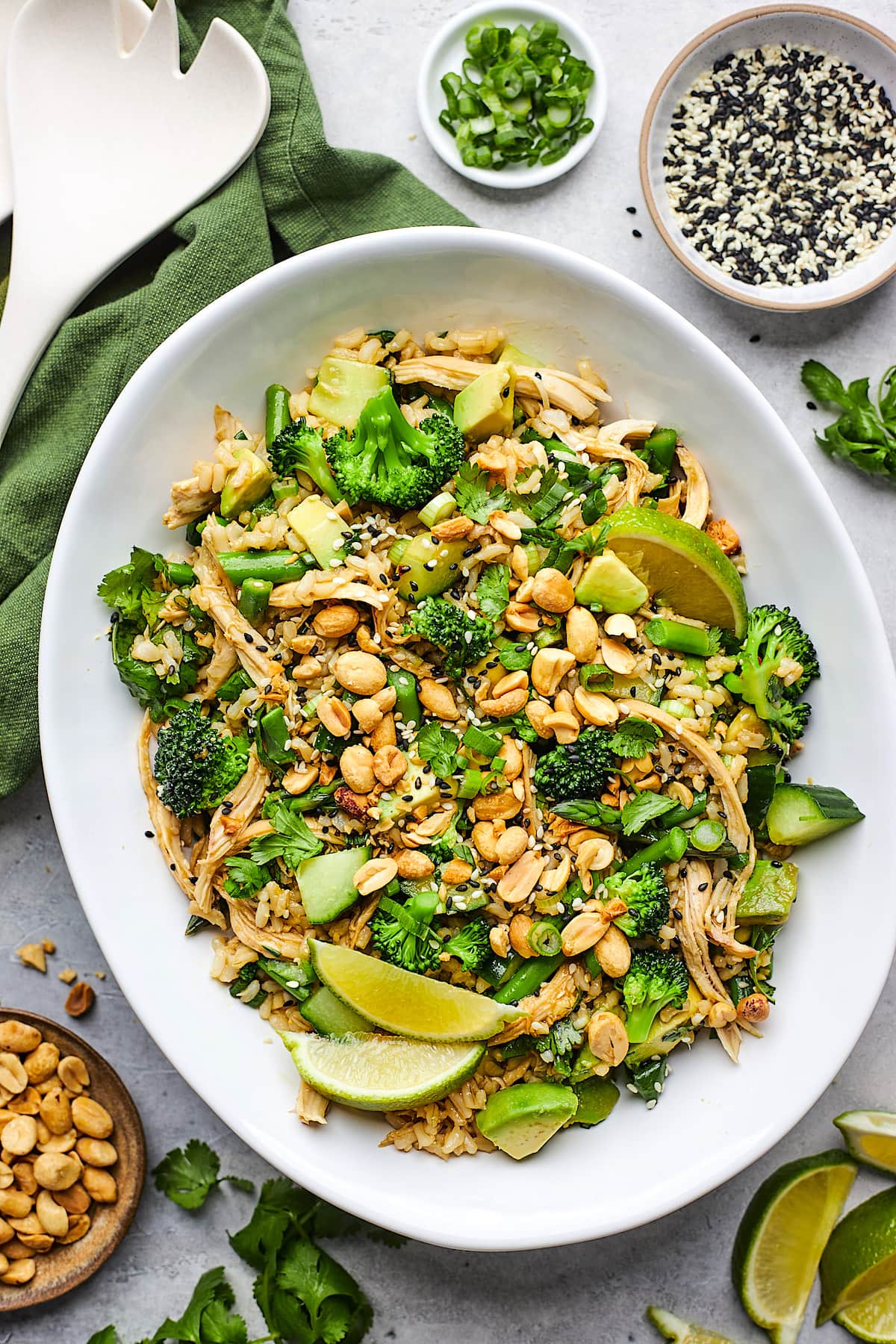 Sesame Ginger Rice Salad with chicken, broccoli, asparagus, avocado, cucumber, peanuts, cilantro, and sesame ginger dressing.