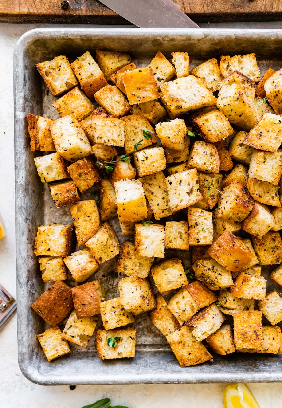 homemade croutons on baking sheet.