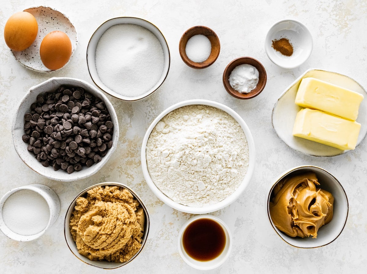 peanut butter chocolate chip cookie ingredients in bowls.