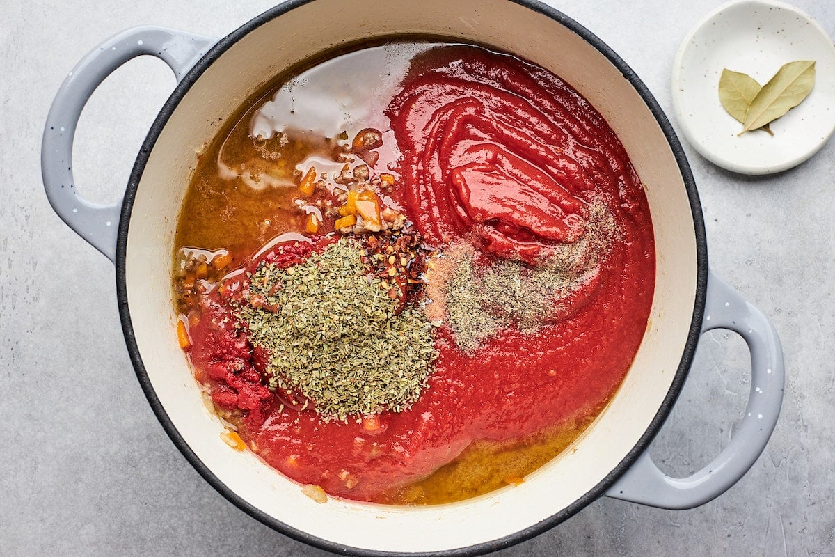 spaghetti sauce ingredients in large pot.