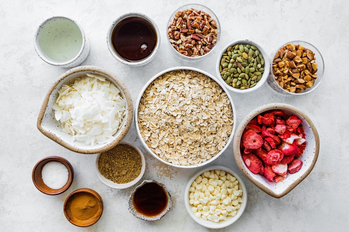 ingredients in bowls to make strawberry granola.