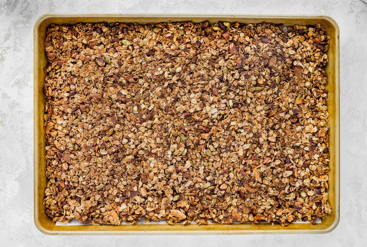 baked strawberry granola on baking sheet.