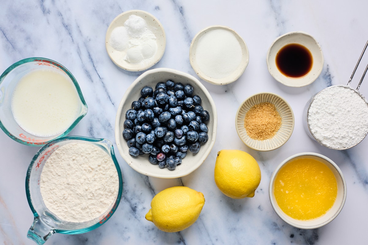 ingredients in bowls to make blueberry biscuits.