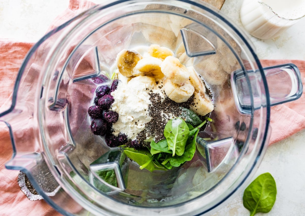 blueberry smoothie ingredients in blender.