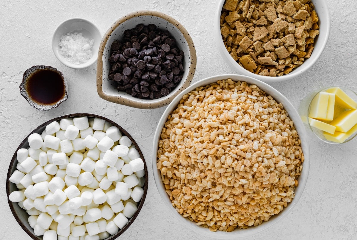 ingredients in bowls to make s'mores rice krispie treats.