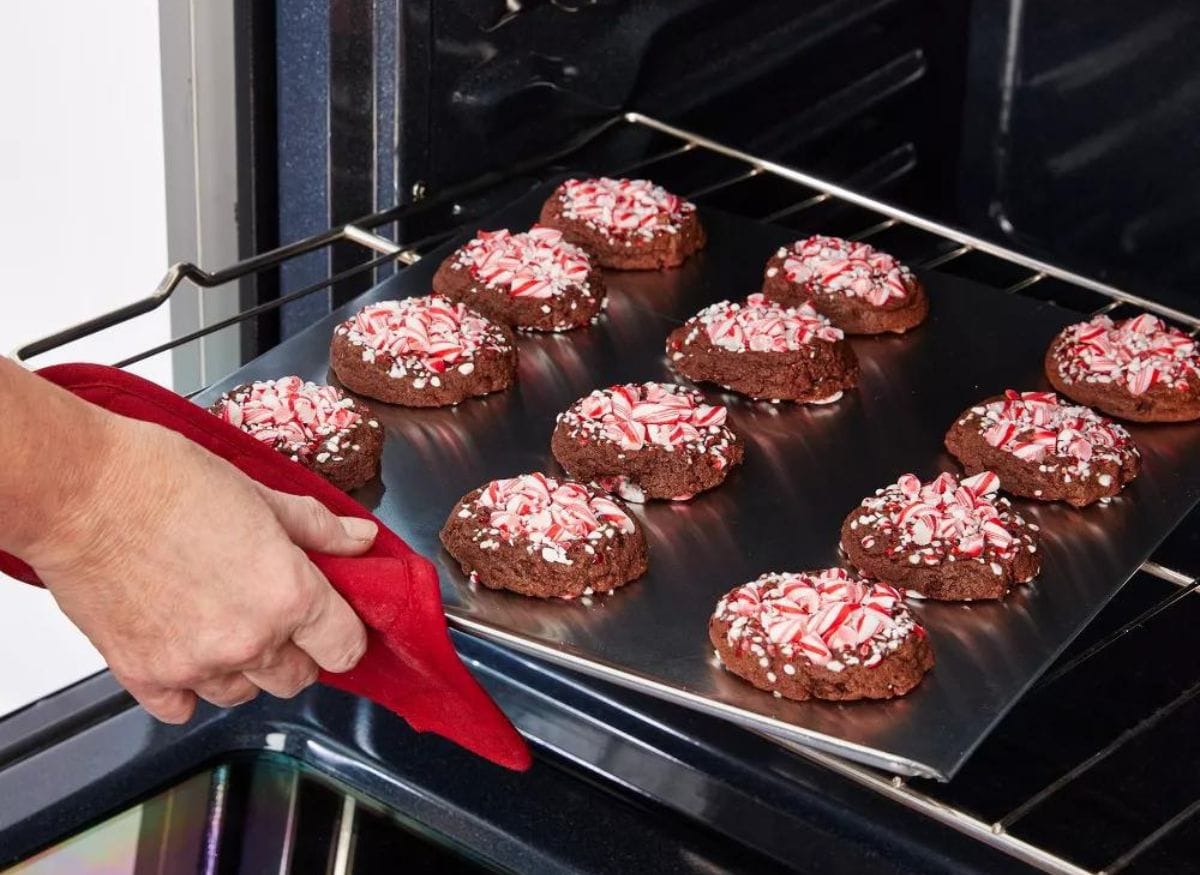 chocolate peppermint cookies on cookie sheet coming out of the oven.