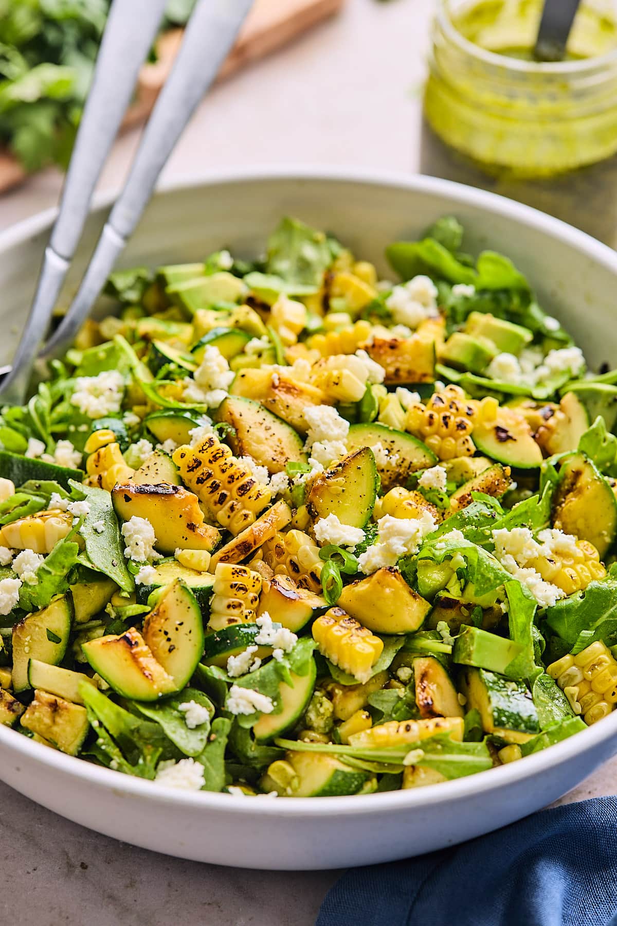 corn zucchini salad in serving bowl.