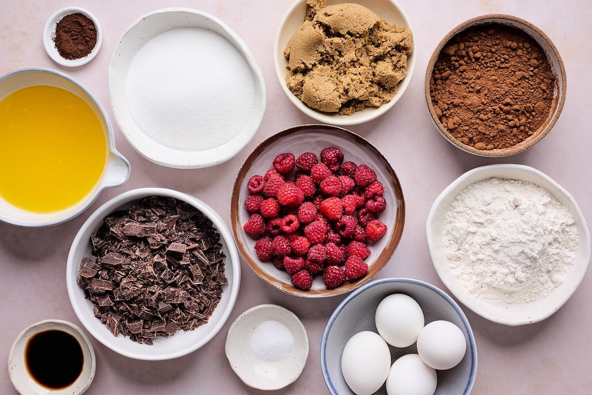 ingredients in bowls to make raspberry brownies.