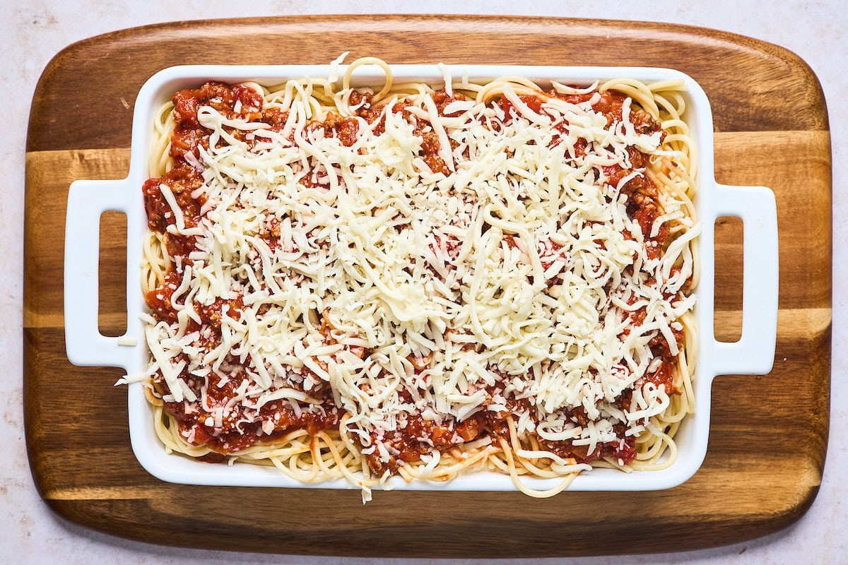 baked spaghetti in baking dish ready to go into the oven.