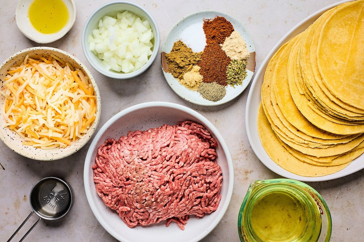 ingredients in bowls to make beef taquitos.