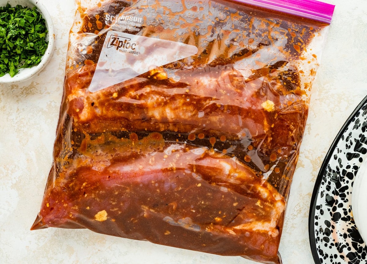 pork tenderloin marinating in Ziploc bag.