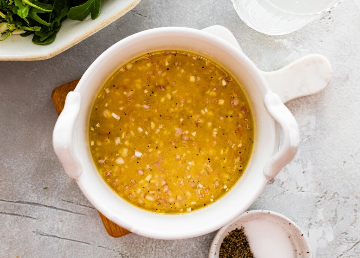 lemon shallot salad dressing in bowl.