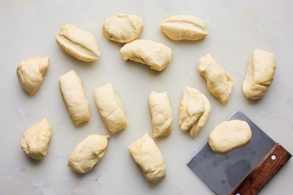 dinner roll dough divided into equal pieces.