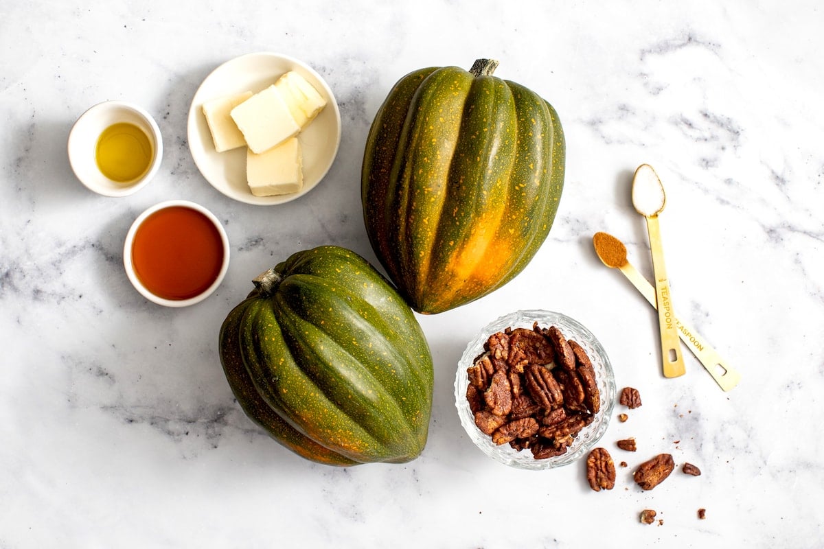 acorn squash, butter, olive oil, maple syrup, cinnamon, salt, and candied pecans.