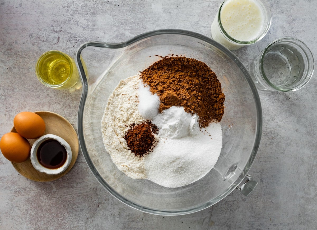 dry ingredients in glass mixing bowl to make chocolate cake.