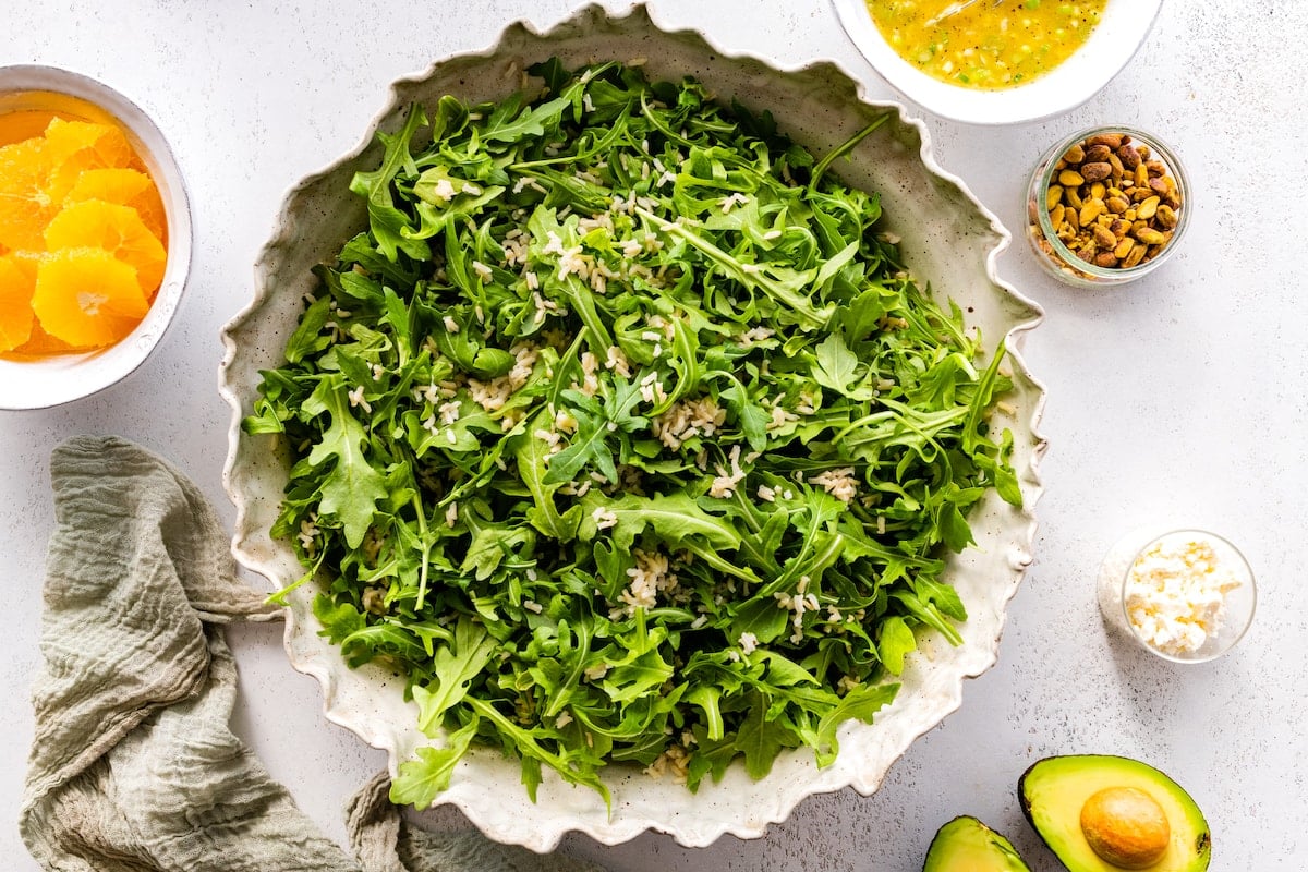arugula in serving bowl with rice.