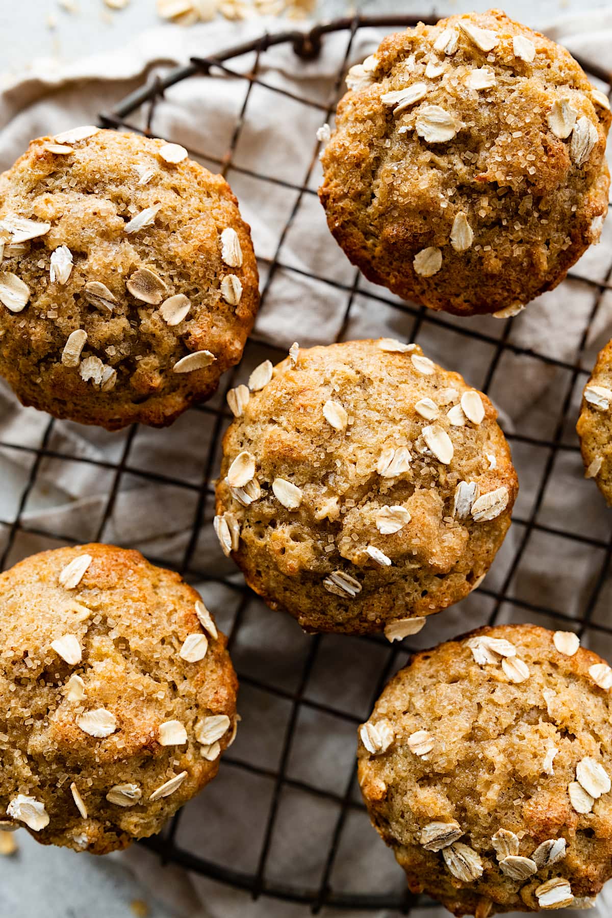 close up of banana oatmeal muffins on cooling rack.