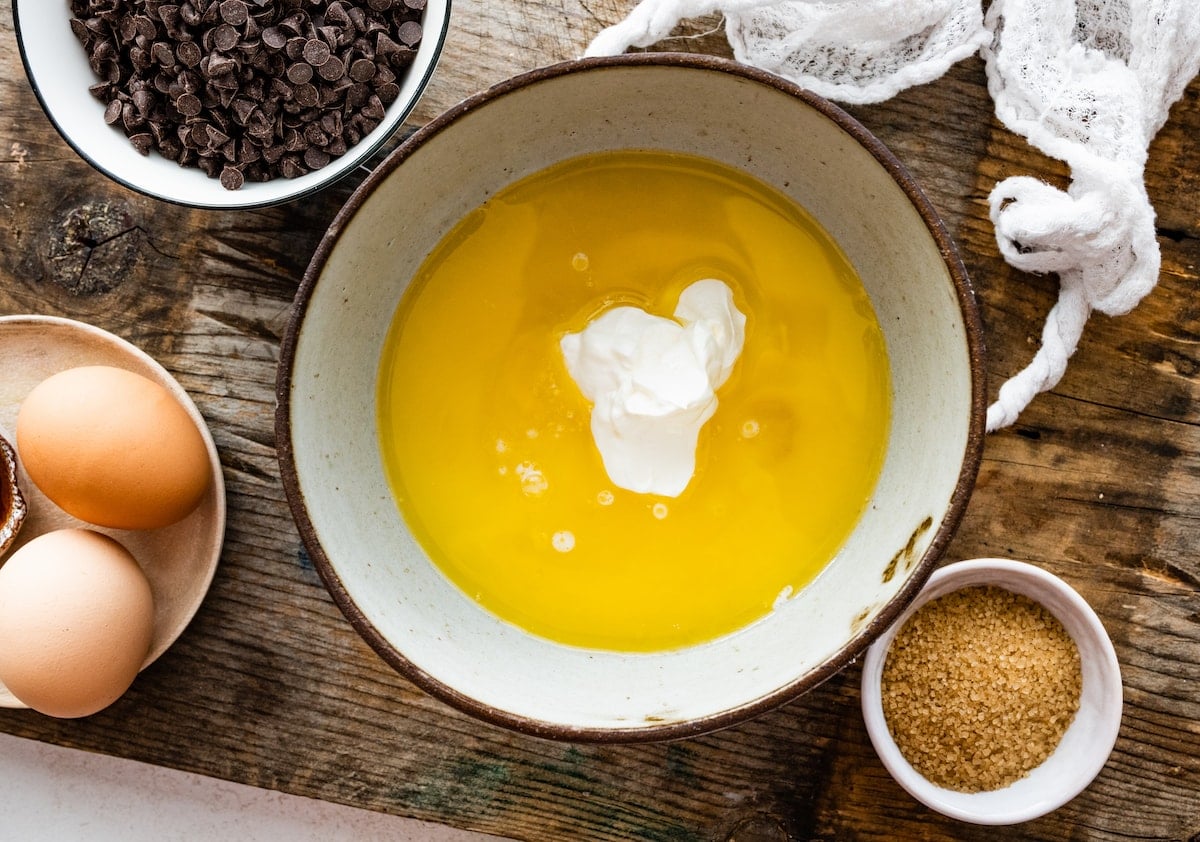 liquid ingredients in mixing bowl to make chocolate chip muffins.
