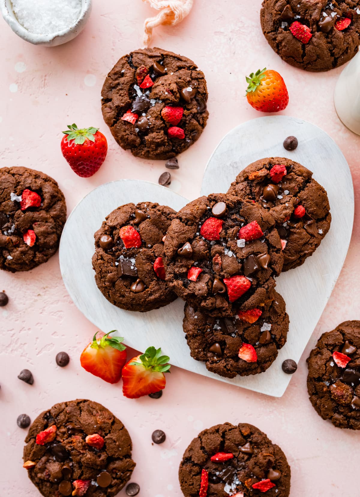 strawberry chocolate cookies on heart board.
