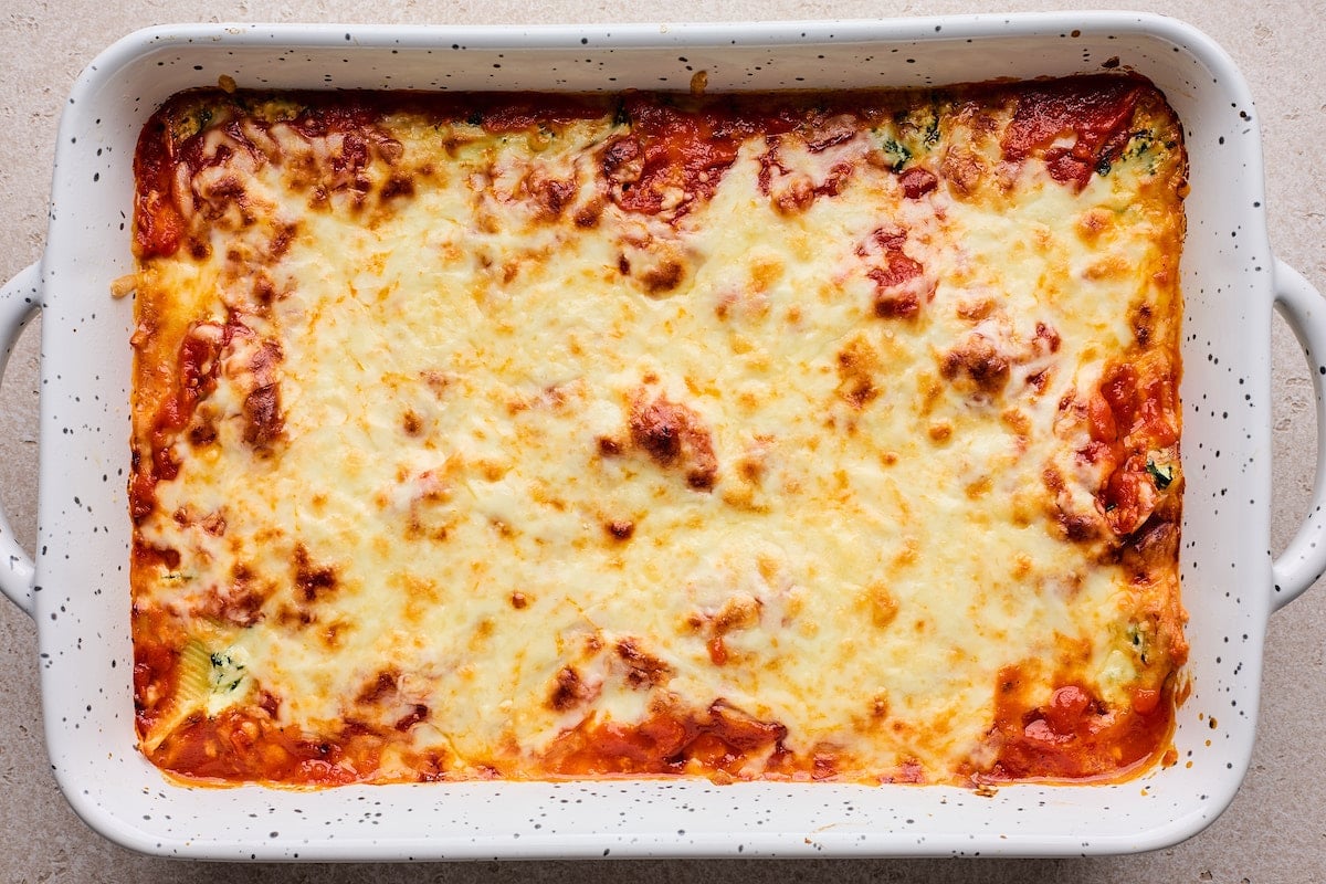 baked stuffed shells in pan.