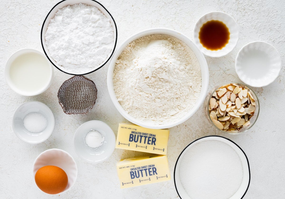 ingredients in bowls to make almond cookies.