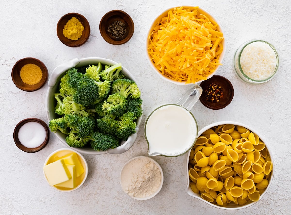 ingredients in bowls to make broccoli mac and cheese.