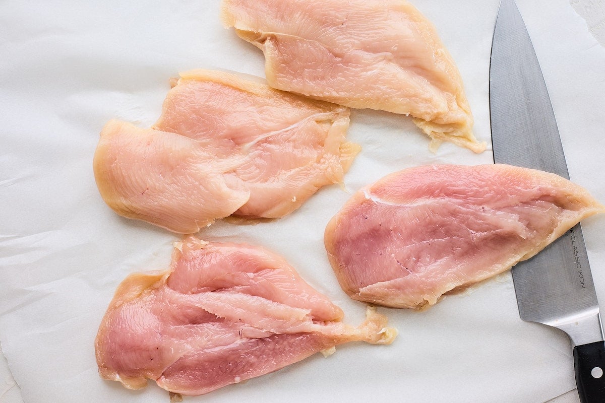 chicken breasts cut in half to make chicken piccata.