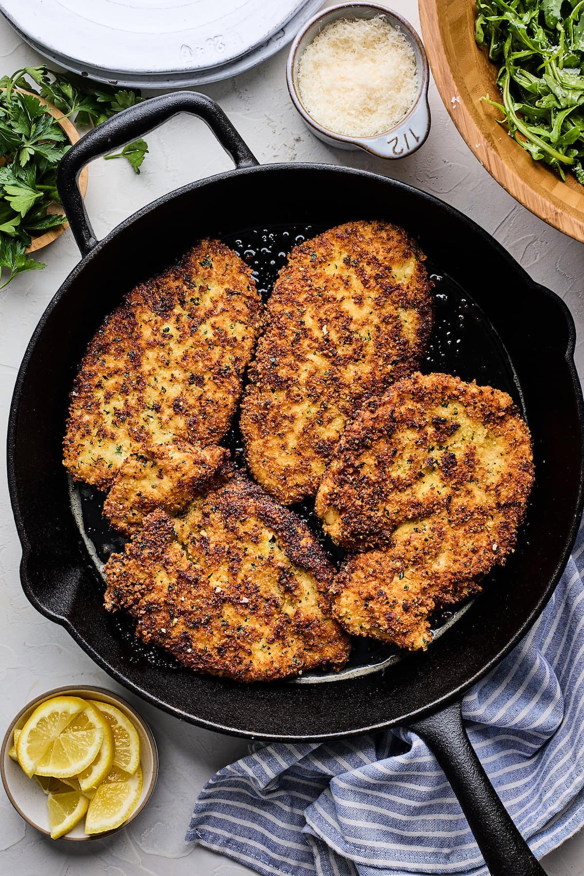 chicken Milanese in cast iron skillet.