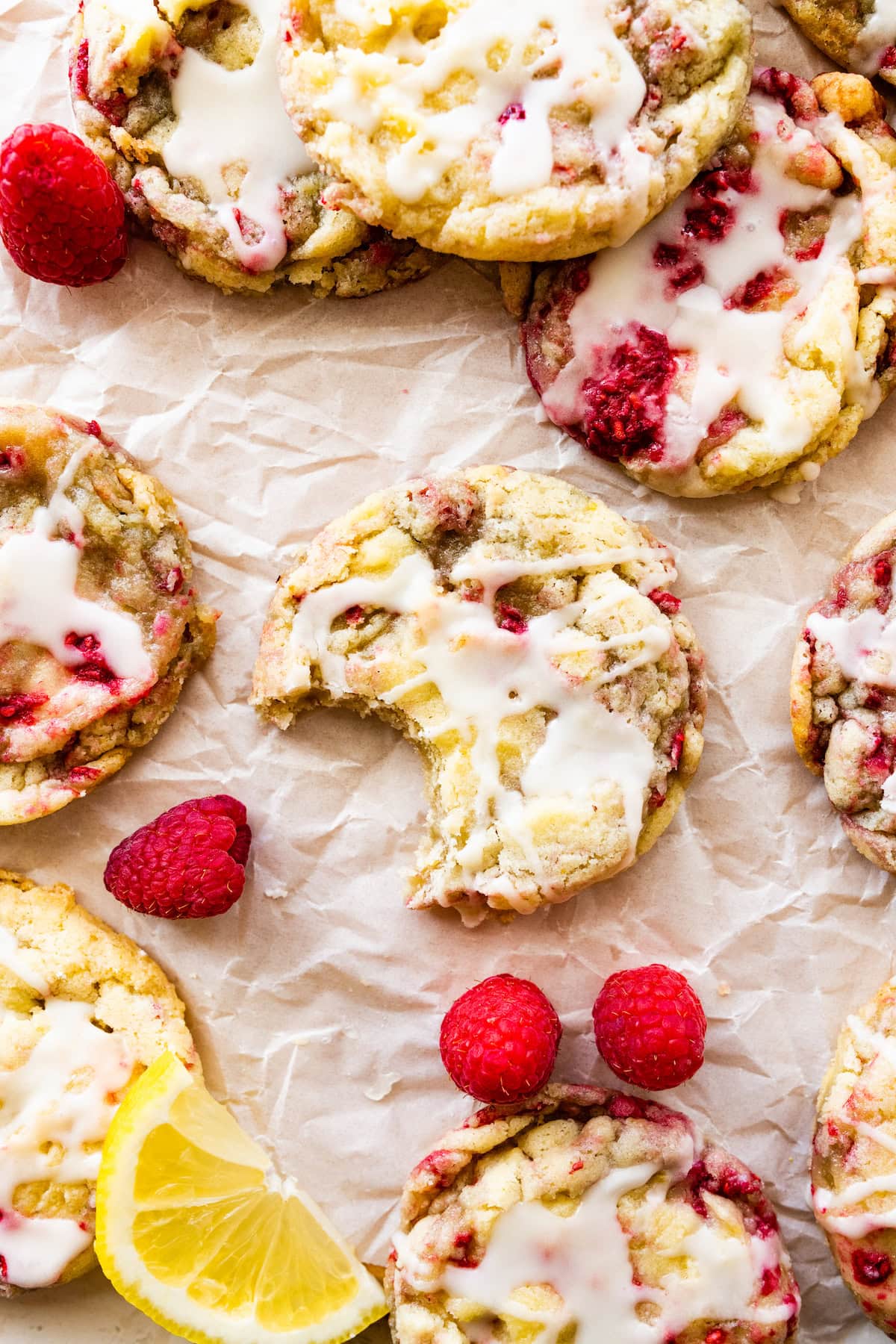lemon raspberry cookie with bite taken out of it.