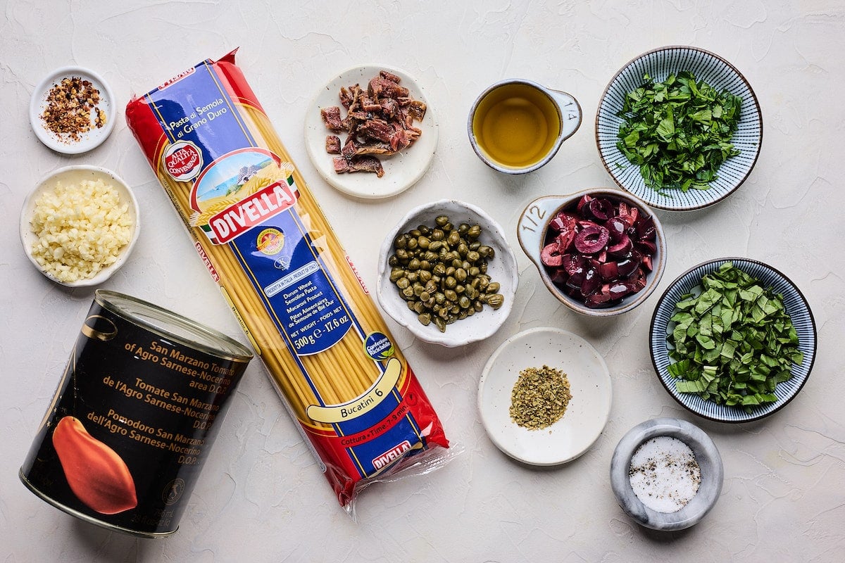 ingredients in bowls to make pasta puttanesca.