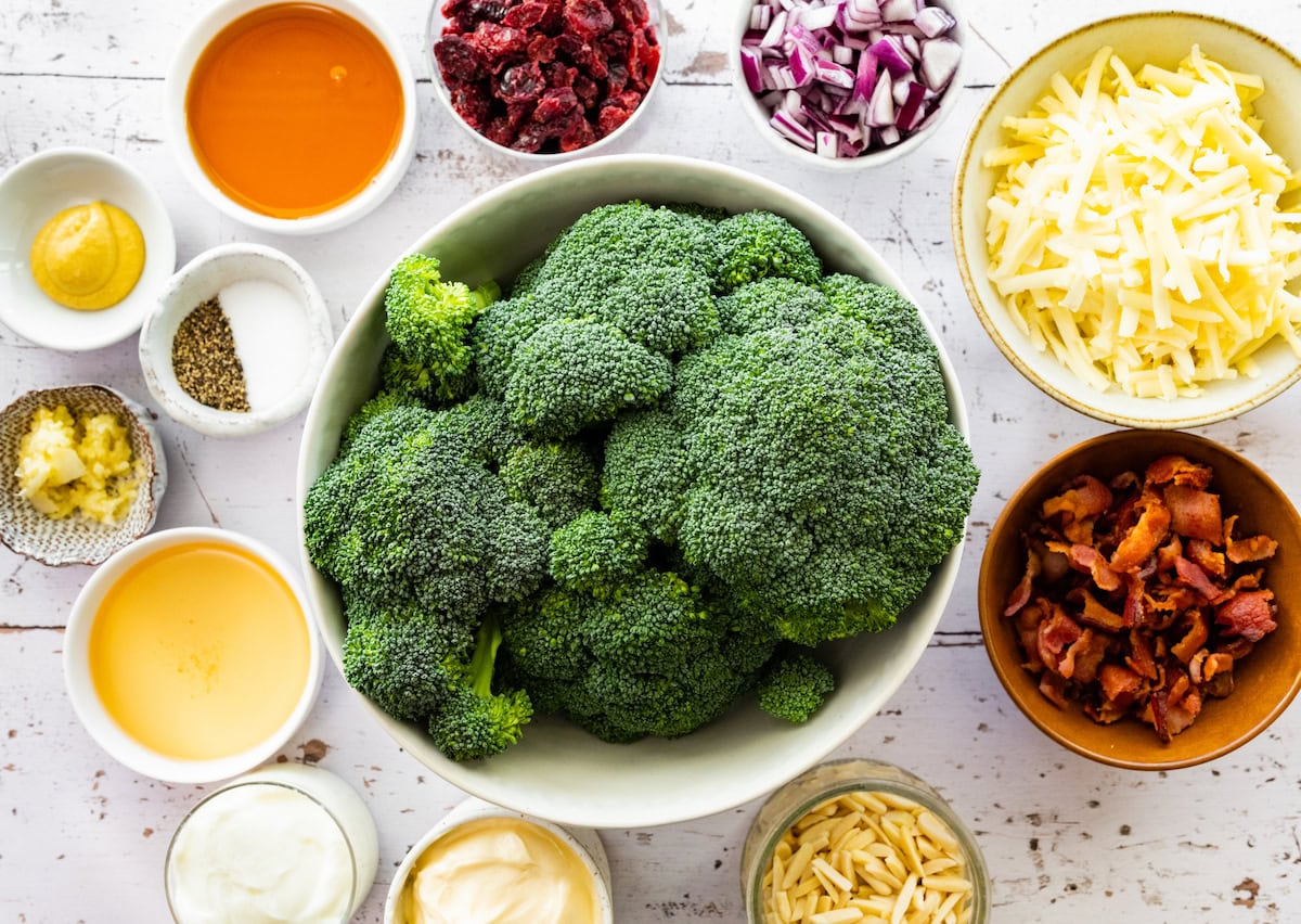 ingredients in bowls to make broccoli salad.