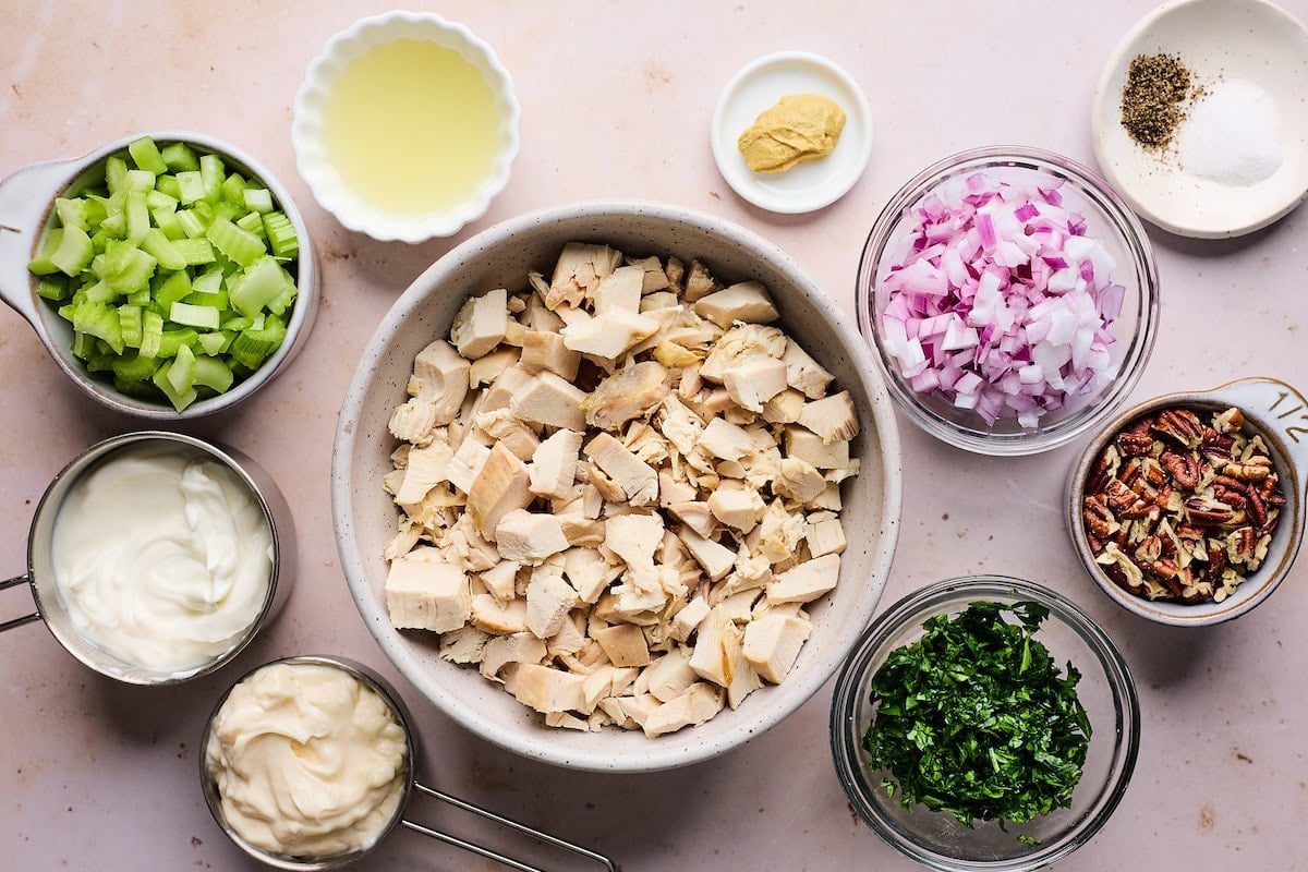 ingredients to make chicken salad in bowls.